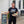 Load image into Gallery viewer, Big Grove man carrying pizza and salad