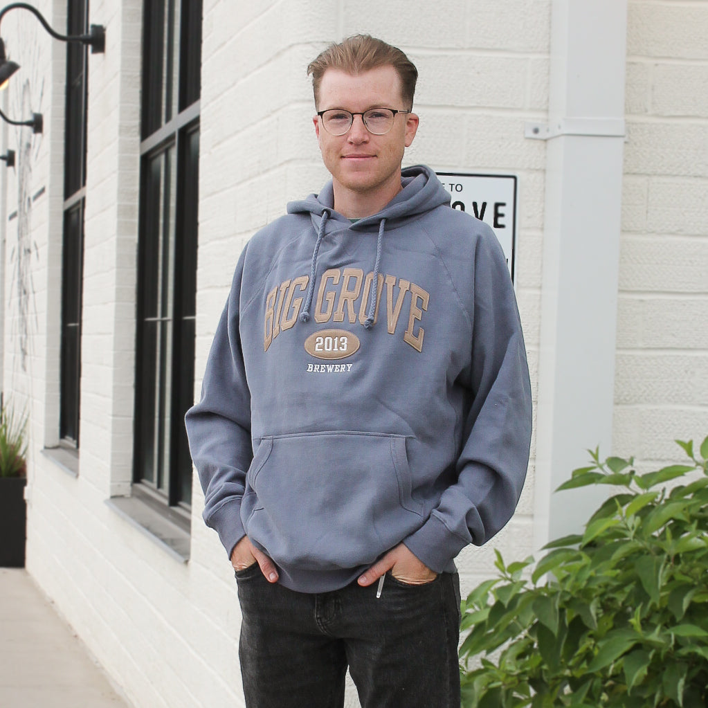 Man wearing Big Grove Brewery gray hoodie with brown lettering