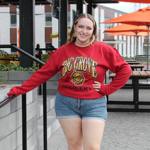 Woman smiling in Big Grove Red 90s Gradient Athletic Crewneck