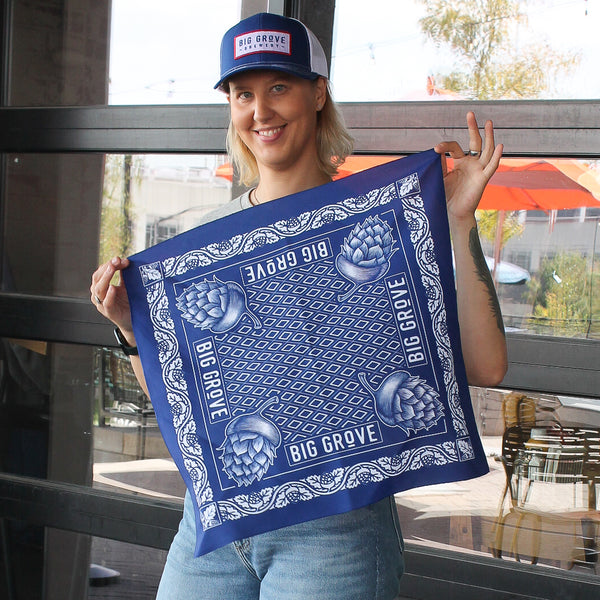 Woman showing unfolded Big Grove bandana