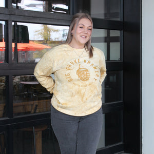 Yellow and gold Big Grove pullover on a woman, farther away