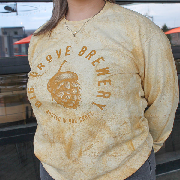 Yellow and gold Big Grove pullover on a woman