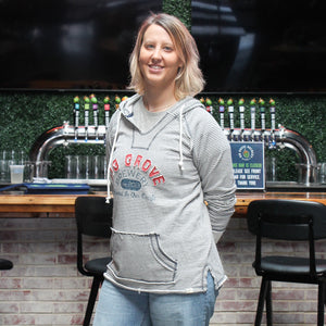 Big Grove Brewery striped hoodie on woman side pose