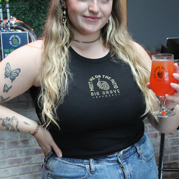 Close-up of Big Grove girl in black top with drink