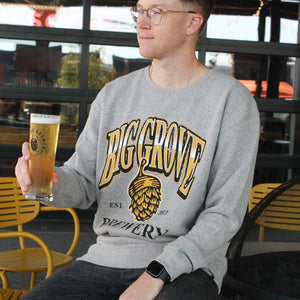 Man with beer in Big Grove Gray 90s Gradient Athletic Crewneck